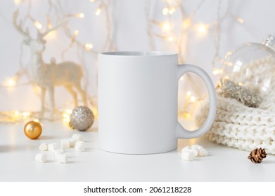 White Ceramic Tea Mug Mockup With Winter Xmas Decorations And Copy Space For Your Design. Front View 10oz Cup Background For Christmas Promotional Content.