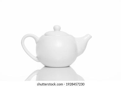 White ceramic teapot on White background. Isolate. Place for your text.