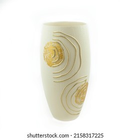 White ceramic vase with hand drawn abstract gold pattern isolated on white background.