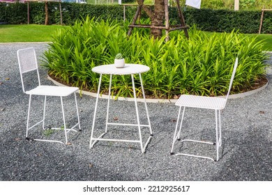 White Chair And Table In Garden,summer Time.