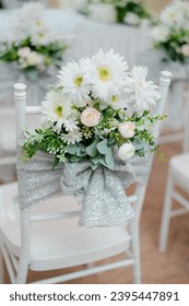 White chair for wedding guests - Shutterstock ID 2395447891