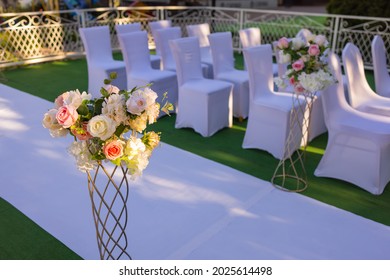 White Chairs With Pink Bows For Wedding Exit Registration.