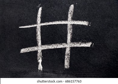 White Chalk Drawing As Tic Tac Toe Blank Shape On Black Board Background