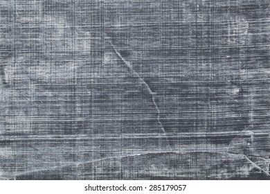 White Chalk Texture On Vintage Slate Blackboard With Scratches And Cracks