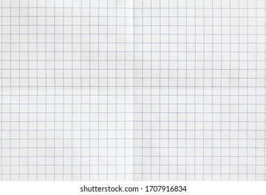 White checkered sheet of exercise book paper folded in two. White crumpled notebook paper texture background. - Powered by Shutterstock