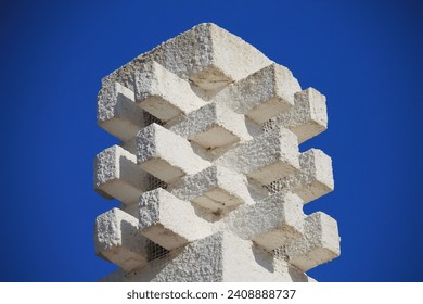 White chimney on deep blue sky background. Beautiful geometric architecture in the Algarve region of Portugal. Typical chimney Tavira - Powered by Shutterstock