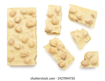 White chocolate bar with pieces isolated on white background. Top view, flat lay