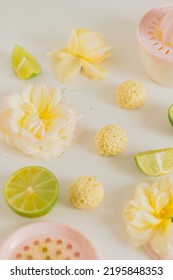 White Chocolate Candies And Lemon Slices On White Background. Food Styling. Spring And Summer Comfort Food.