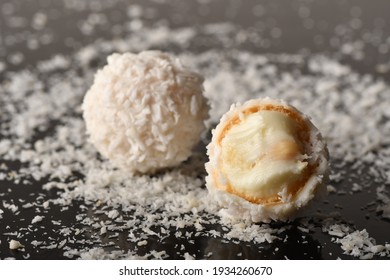 White Chocolate Candy With Coconut Topping On Black Background

