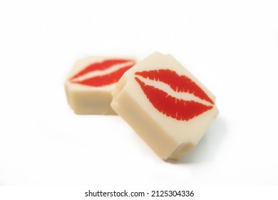 White Chocolate Candy With Red Lipstick Kisses. Shallow Depth Of Field.