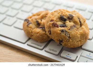 White Chocolate Chip Cookies On Keyboard Computer Background Copy Space. Cookies Website Internet Homepage Policy Accepted Or Blocks Concept.