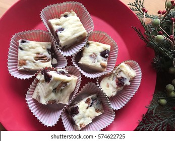 White Chocolate Fudge With Pecans And Dried Cranberries With Christmas Greenery