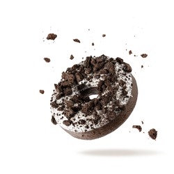 White Chocolate Glazed Donut With Dark Cookies Crumbs And Creme Filled Closeup Flying. Sweet Doughnut Falling Isolated On White Background