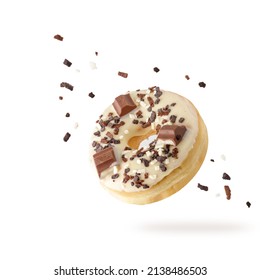 White Chocolate Glazed Donut With Dark Crumbs And Creme Filled Closeup Flying. Sweet Doughnut With Sprinkles Falling Isolated On White Background