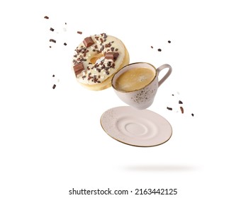 White Chocolate Glazed Donut  And Vintage Beige Cup Of Hot Coffee With Dark Crumbs  Flying Isolated On White. Ceramic Light  Grey Cup Coffee With Doughnut Falling.