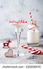 White Chocolate Peppermint Martini With Candy Cane Rim. Christmas Holiday Party Drink Idea