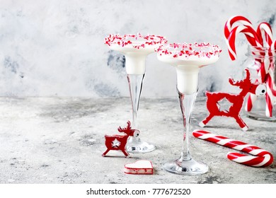 White Chocolate Peppermint Martini With Candy Cane Rim. Christmas Holiday Party Drink Idea