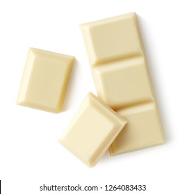 White chocolate pieces isolated on white background. Top view - Shutterstock ID 1264083433
