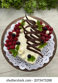 White Chocolate Rasberry Cake With Dark Chocolate Decoration
