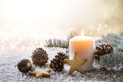 White Christmas Candle On Rustic Wooden Boards - Decoration With Natural Elements, Twigs, Pine Cones And Cookies.