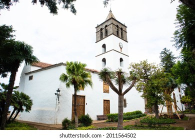 white church with a tower in a small town in Tenerife - Shutterstock ID 2011564502