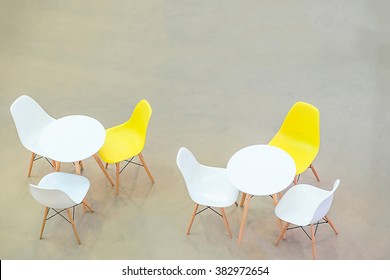 White Circle Table And Chairs On Carpet Floor. View From Above