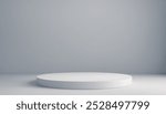 White circular platform in a minimal, clean, gray studio setting. Premium photo mockup for product photography purposes.