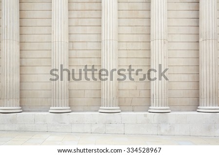 White classical columns and wall background with stone floor