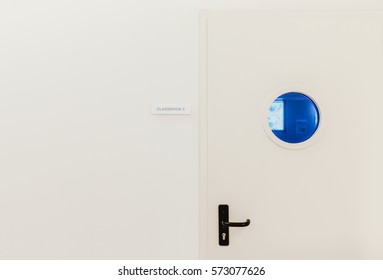 White Classroom Door With Sign