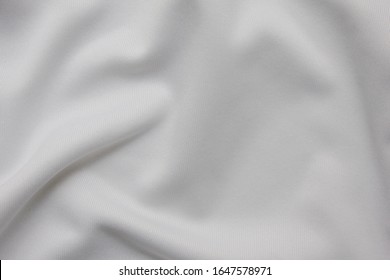 White Clean Sheet Material, Empty Bed Sheet Fabric Pattern. Crumpled Cloth Surface, Horizontal White Background Mockup, Flat Lay Top View 