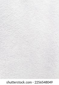 White clean wool texture background. light natural sheep wool. white seamless cotton. texture of fluffy fur for designers. close-up fragment white wool carpet.	