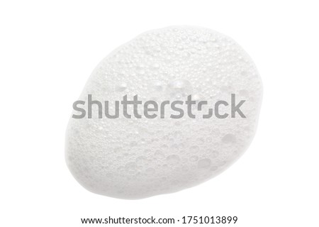 White cleanser foam bubbles drop isolated on white. Soap, shower gel, shampoo foam texture closeup
