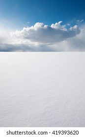 White Clear Surface Of Snow Till Flat Horizon And Beautiful Cloudscape; Copy Space