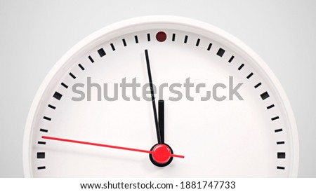White clock isolated on white background Showtime 11.58 am, Time concept.