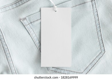 White Clothing Tag Mockup On A Jeans.