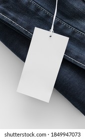 White Clothing Tag Mockup On A Jeans.