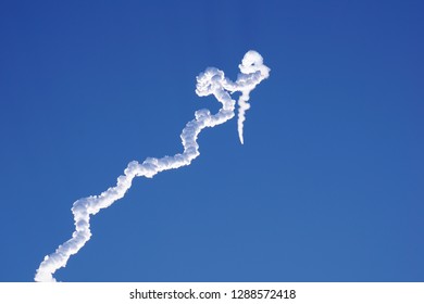 White cloud leaved by Epsilon rocket, launched from Uchinoura Space Center, Japan - Powered by Shutterstock - Get 15% off with code: PIKWIZARD15