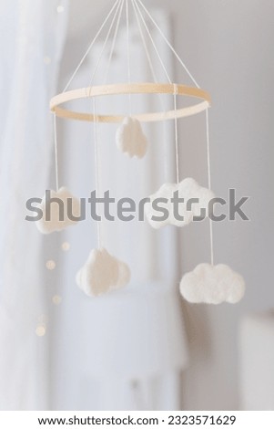 White cloud mobile in nursery