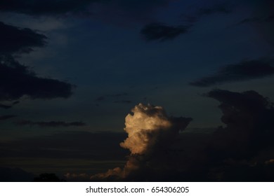 white cloud on Dramatic dark sky at sunset.