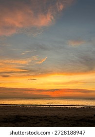 White cloud with orange cloud. The sun is setting mixing altogether