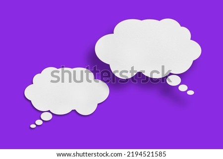 white cloud paper speech bubble shape against purple background design.