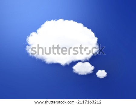 White cloud shape of a thinking balloon at 
blue background, concept communication.