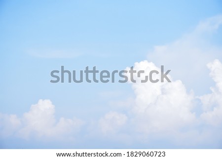 White clouds in the afternoon of the day with bluesky background, blurred background of clouds and bluesky. Natural blurred background.