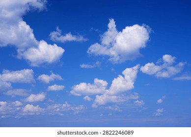 White clouds blue sky background. White fluffly clouds texture.