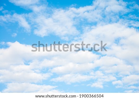 White clouds with blue sky background copy space. Sunshine day with beautiful clouds.