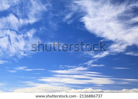 White clouds blue sky background. White fluffly clouds texture.