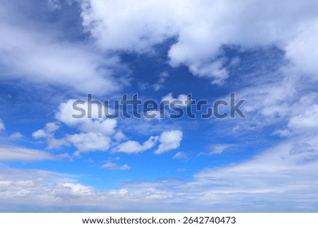 White clouds blue sky background. White fluffly clouds texture.