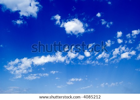 White clouds in the blue sky. Cloudscape