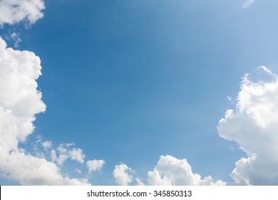 White Clouds In Blue Sky On Day Noon Light.