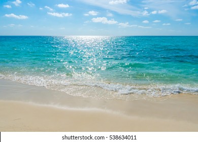 White Clouds With Blue Sky  Over Calm Sea Beach In Tropical Maldives Island